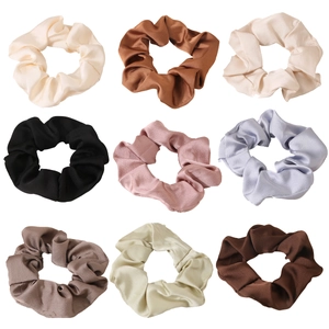 Nine-piece set of satin silk scrunchies in cream, gold, and assorted vintage colors