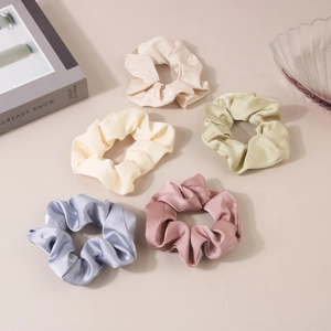 Set of 5 minimalist satin scrunchies in pastel colors including champagne and rose pink