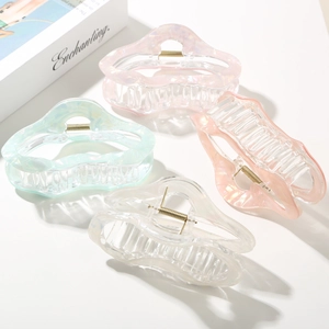 Set of four pearlescent cloud hair claws in pink, peach, mint, and white finishes