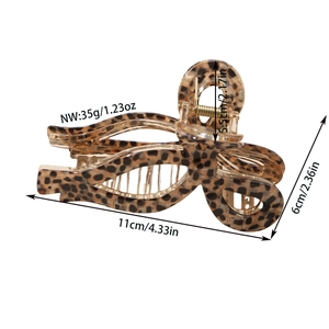 Acetate leopard print claw clip for women featuring hollow cross design and gold metal spring