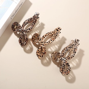 3-pack leopard print acetate hair claws in hollow bow design for elegant styling