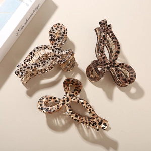 Three-piece set of tortoiseshell acetate claw clips featuring leopard print patterns