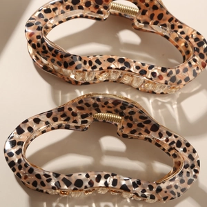 Pair of retro leopard print hair claws with gold springs and vintage acrylic finish
