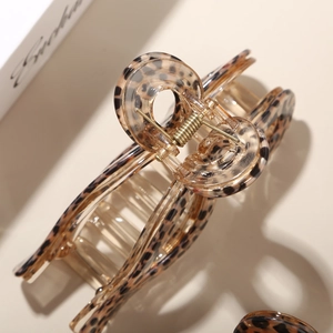 Close-up of leopard print acetate hair claw clip with a durable golden metal spring