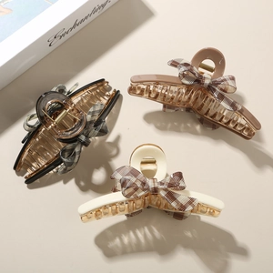 Three-piece set of acetate claw clips with elegant plaid bows and metal spring detail