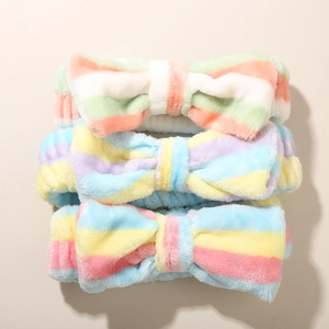 Three-pack of soft plush striped bow headbands for facial cleansing and skincare