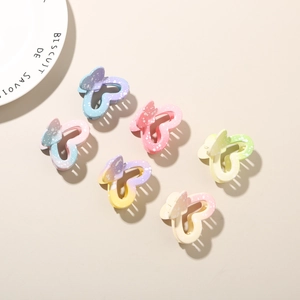 Set of six colorful butterfly hair clips with matte finish and heart-shaped cutouts