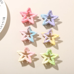 Set of 6 colorful gradient star-shaped claw clips with matte finish and ink splatters