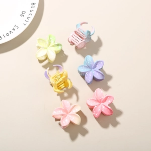 Set of six macaron-colored frangipani flower hair claws in a matte finish for hair styling