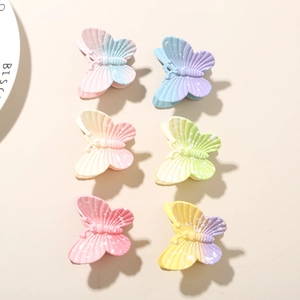 Détail de 6 pinces à cheveux papillon dégradé macaron avec motifs à pois blancs