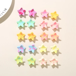 Detailed view of twenty colorful macaron star-shaped mini hair clips on a minimal background