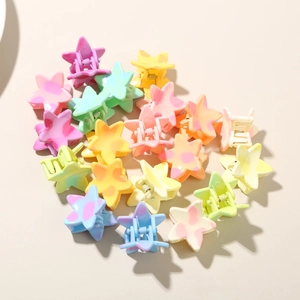 Detailed macro view of colorful star-shaped hair clips with matte polka dot texture