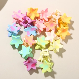 Star-shaped mini hair clips in colorful macaron shades with spotted patterns