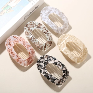 Five pieces of minimalist oval acetic acid hair clips in marble and tortoiseshell patterns
