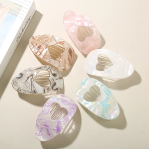 Set of six colorful heart-shaped acetate hair clips with premium pearlescent finish