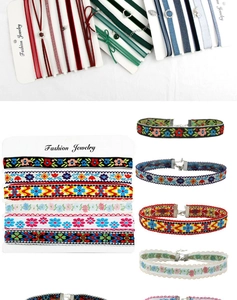Detailed close-up of velvet and embroidered floral choker necklaces with metal clasps