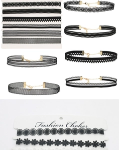 Detail of diverse black lace choker necklace set with golden lobster clasps and extenders