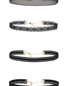 Detail view of four black velvet and lace choker necklaces with adjustable gold clasps