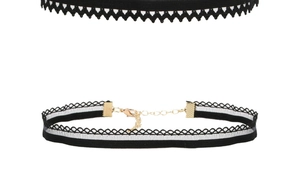 Close-up of black velvet choker with white lace trim and adjustable golden lobster clasp