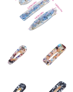 Vue détaillée de barrettes en acétate avec texture marbrée et dimensions indiquées