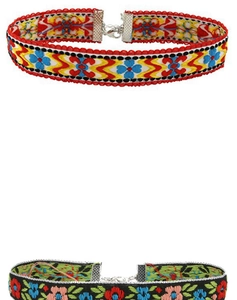 Detailed view of ethnic embroidered choker necklaces with colorful floral patterns and metal clasps