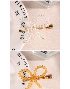 Détails de barrettes nœuds perlés en cristal et ambre avec base en métal doré