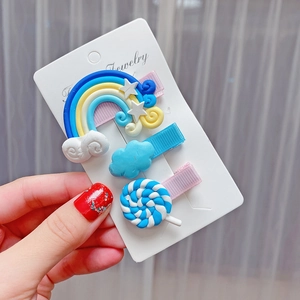 Detailed view of 3pcs kids hair clips set with rainbow, cloud, and candy resin shapes