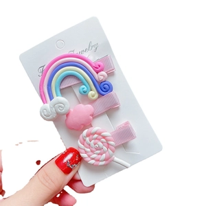 Cute rainbow and candy hair clip set for girls with colorful resin charms and pink ribbon