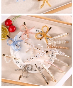 Détails des barrettes à perles de cristal colorées avec motifs nœuds sur plat