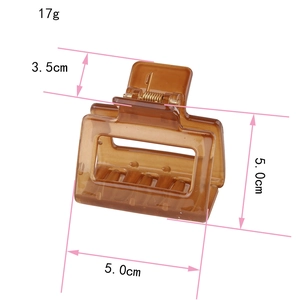Detail showing amber rectangle acrylic hair claw dimensions 5cm and 17g weight