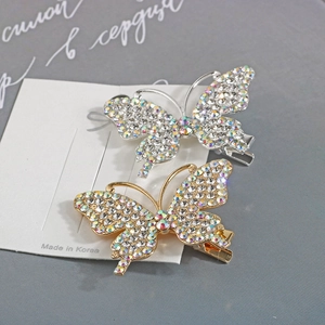 Detail of butterfly hair clips with iridescent rhinestones and alloy duckbill base