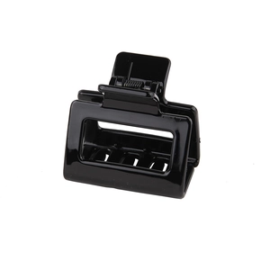 Classic black rectangular hollow hair claw clip with glossy finish and metal spring