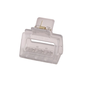 Detail of grey rectangular acrylic hair claw clip with golden metal spring mechanism