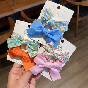 Five-piece bow hair clips set with floral and solid patterns for women and girls