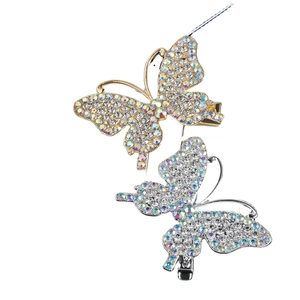 Dainty butterfly rhinestone hair clips in gold and silver finish on white background