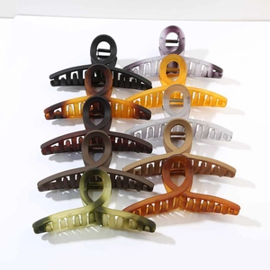 Detailed set of nine 13cm large hair claw clips in various matte and translucent colors