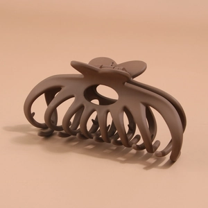 Detail of a large 12cm dark brown matte claw clip with sturdy interlocking teeth for thick hair