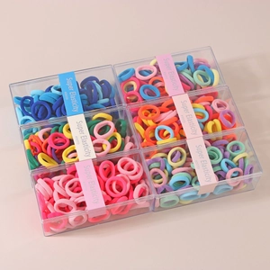 Detail view of high elasticity hair ties in six colorful sets with transparent box storage