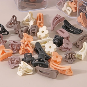 Morandi colors matte resin mini hair claw clips set in various shapes on beige surface