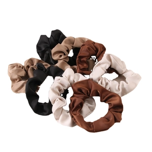 Set of milk silk scrunchies in cream and earth tones for ponytail hairstyles