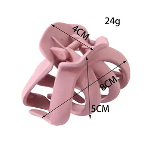 Pince à cheveux rose mat de 8cm avec huit griffes en plastique et ressort en métal