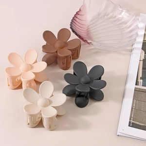 Matte flower hair claws set in cream, pink, brown, and black for women styling