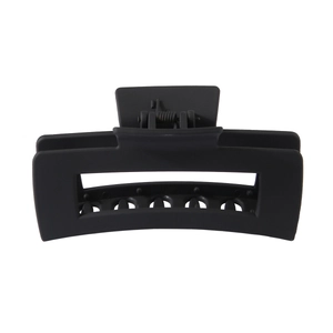 Detailed view of large matte black rectangular hair claw clip with strong metal spring