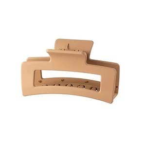 Macro shot of large matte beige hair claw clip with geometric hollow rectangle design