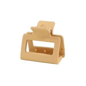 Close-up of matte rectangular hair claw clip with strong metal spring and non-slip teeth