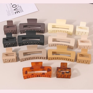 Selection of matte rectangular hair claws in various colors and sizes for women