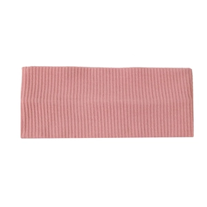 Detail view showing pink ribbed knit fabric texture and elastic stretch of the headband