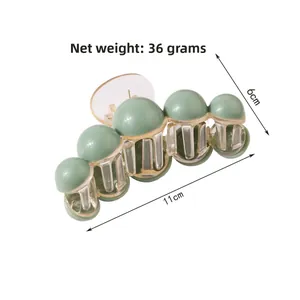 Detailed view of 11cm bean green hair claw clip with size and 36g weight labels