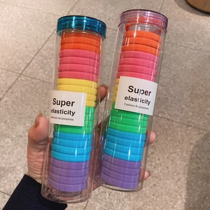 Elastici per capelli arcobaleno ad alta elasticità in un contenitore trasparente
