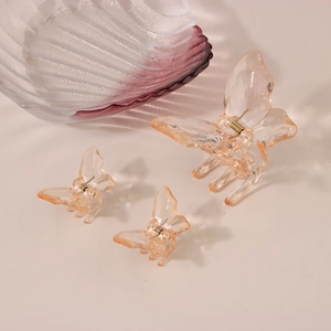 Ensemble de trois pinces à cheveux papillon en résine ambrée transparente avec ressorts